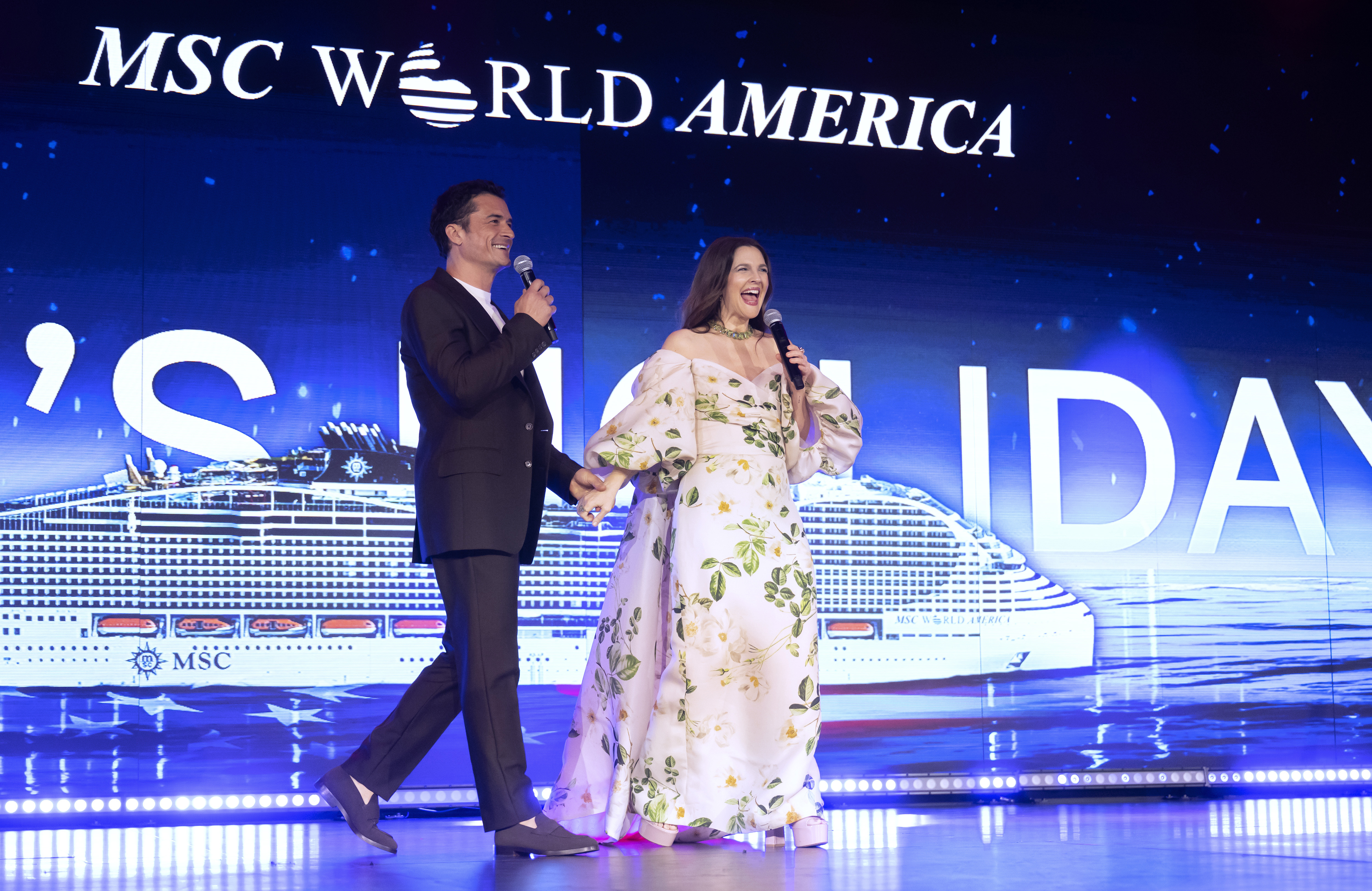 MIAMI, FLORIDA - APRIL 09: Drew Barrymore and Orlando Bloom on stage during the MSC World America Naming Ceremony onboard MSC Cruises' new ship in Miami on April 09, 2025 in Miami, Florida. (Photo by Anthony Devlin/Getty Images for MSC World America)