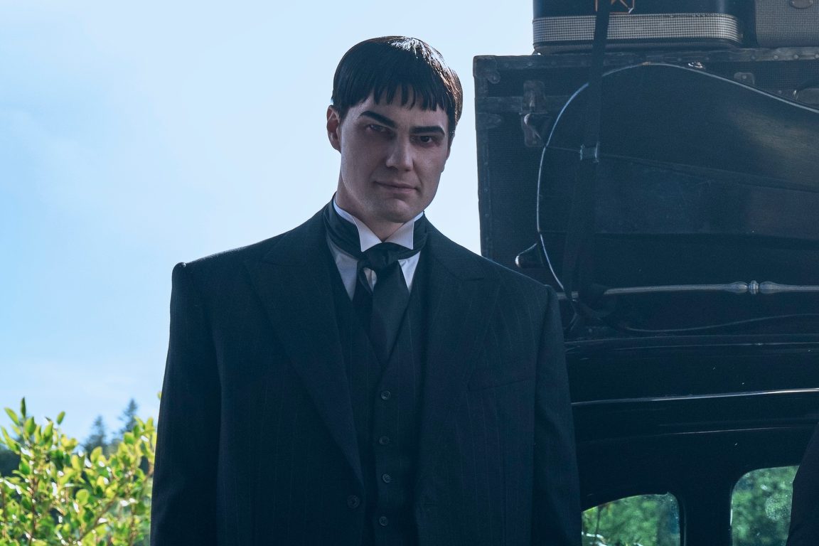 Wednesday. (L to R) Joonas Suotamo as Lurch, Catherine Zeta-Jones as Morticia Addams, Jenna Ortega as Wednesday, Isaac Ordonez as Pugsley Addams, Thing, Luis Guzmán as Gomez Addams in episode 201 of Wednesday. Cr. Helen Sloan/Netflix © 2025