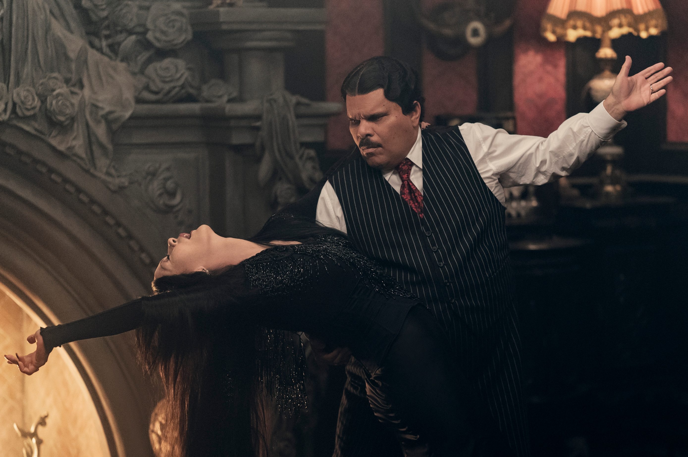 Wednesday. (L to R) Catherine Zeta-Jones as Morticia Addams, Luis Guzmán as Gomez Addams in episode 203 of Wednesday. Cr. Jonathan Hession/Netflix © 2025