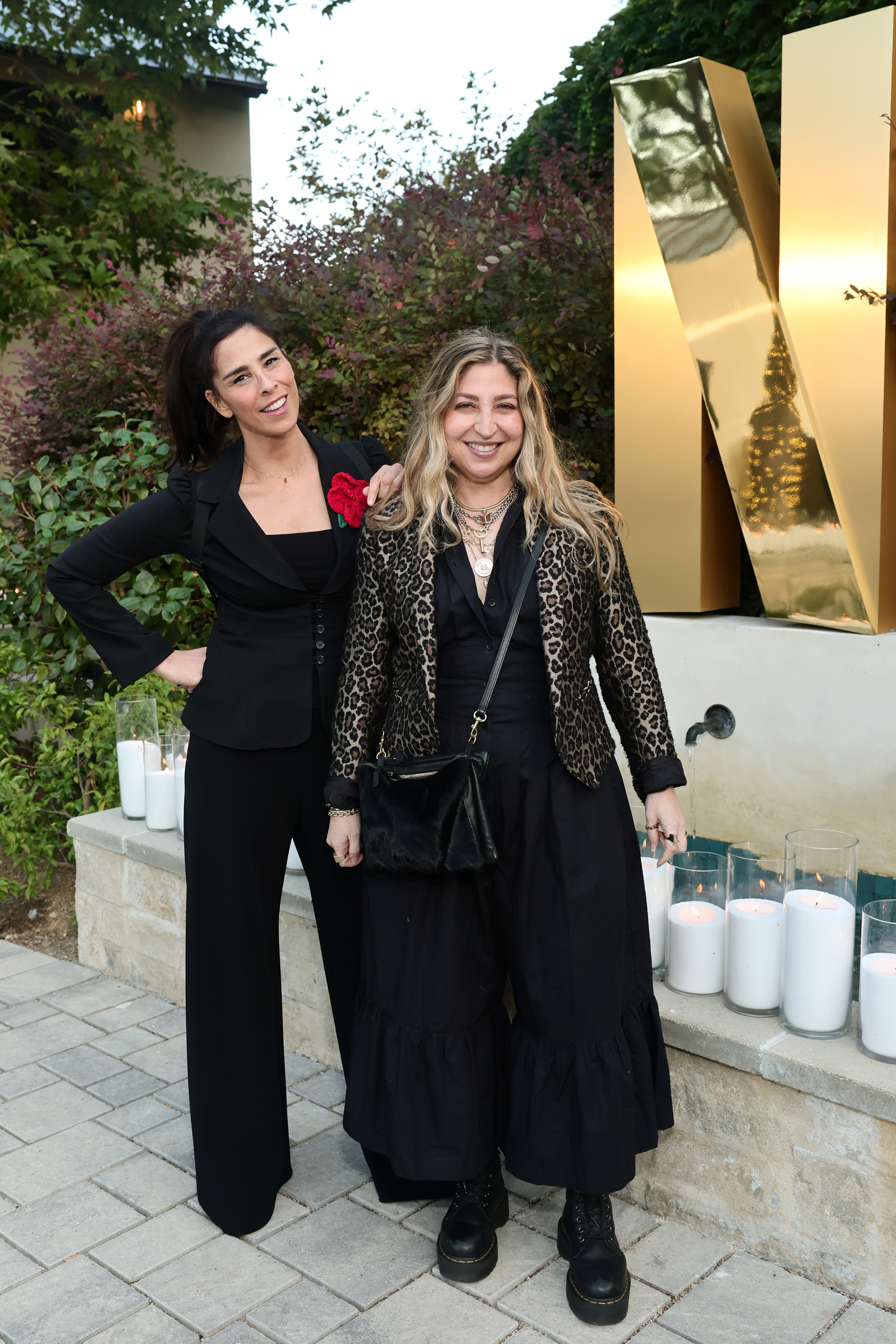 STUDIO CITY, CALIFORNIA - SEPTEMBER 12: (L-R) Sarah Silverman and Amy Zvi attend Netflix's 2025 Emmy's Toast at Private Residence on September 12, 2025 in Studio City, California. (Photo by Emma McIntyre/Getty Images for Netflix)