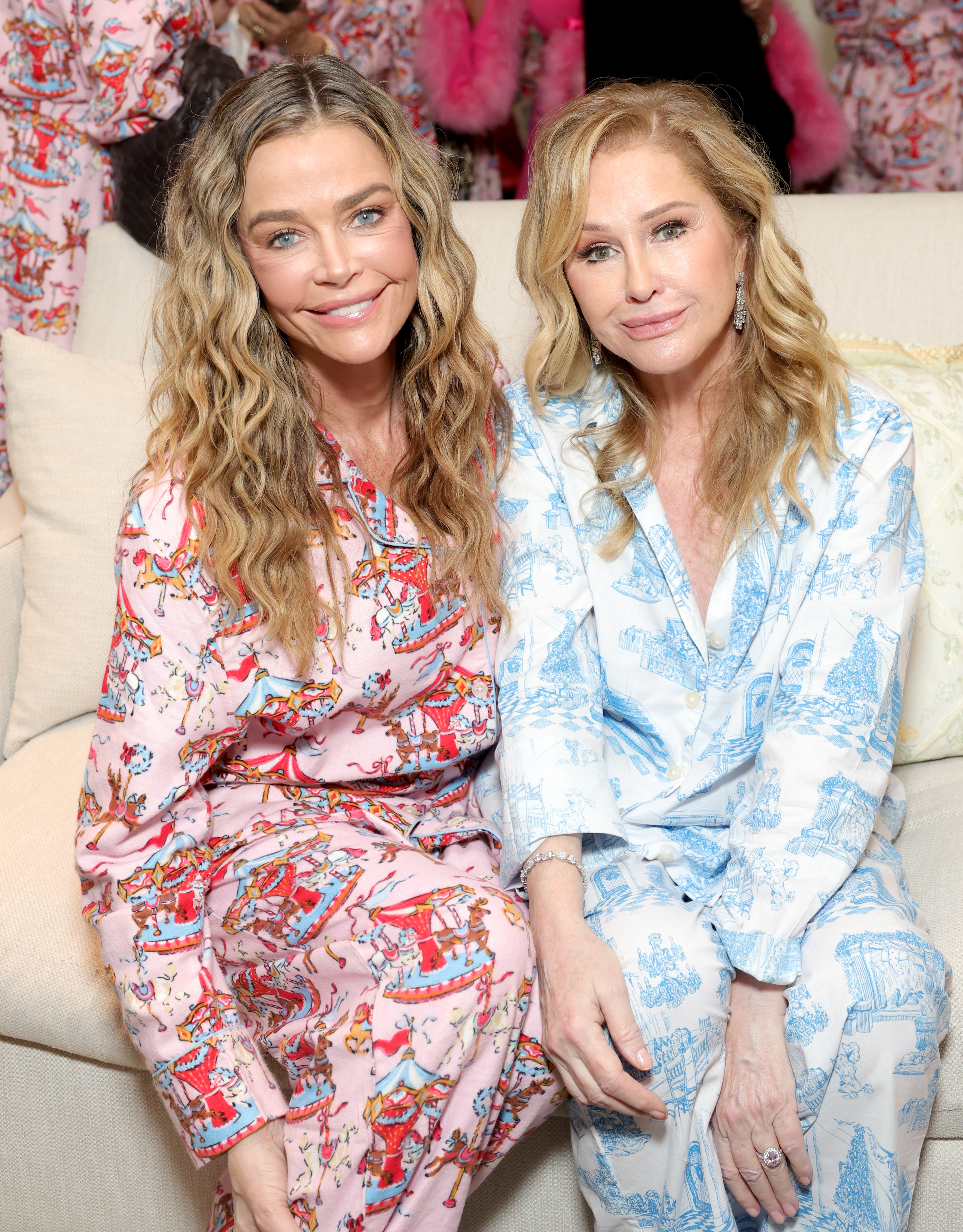 LOS ANGELES, CALIFORNIA - NOVEMBER 04: (L-R) Denise Richards and Kathy Hilton, wearing her QVC exclusive Printfresh pajama set, attend Kathy Hilton's Pajama Party Presented by QVC at a Private Residence on November 04, 2025 in Los Angeles, California. (Photo by Stefanie Keenan/Getty Images for QVC)