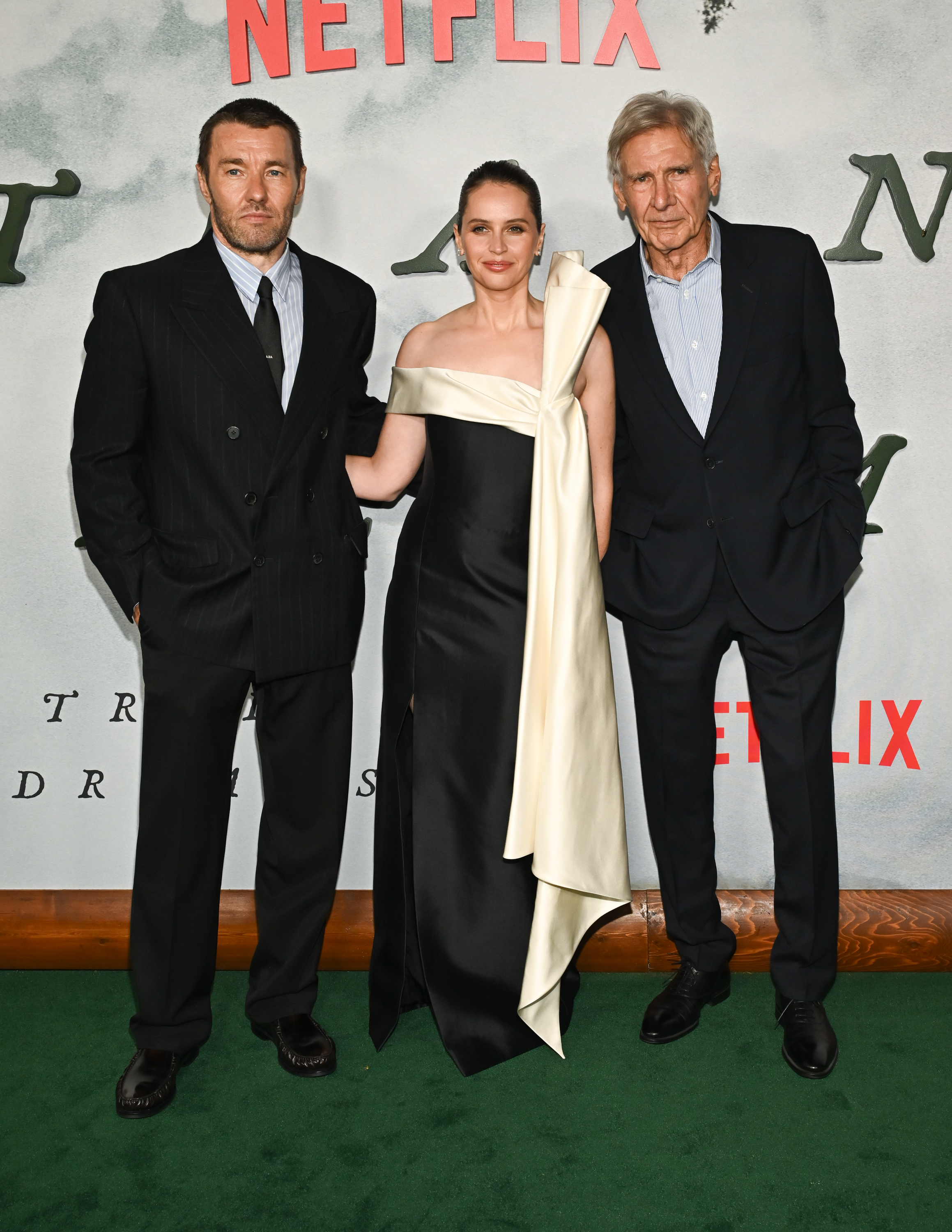 Joel Edgerton, Felicity Jones and Harrison Ford at Netflix's "Train Dreams" Los Angeles Premiere held at the Egyptian Theater on November 03, 2025 in Los Angeles, California.