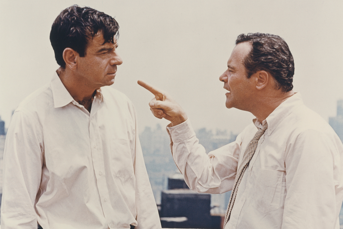 Jack Lemmon points finger at Walter Matthau on rooftop in a scene from the 1968 Neil Simon comedy 'The Odd Couple'. (Photo by Screen Archives/Getty Images)