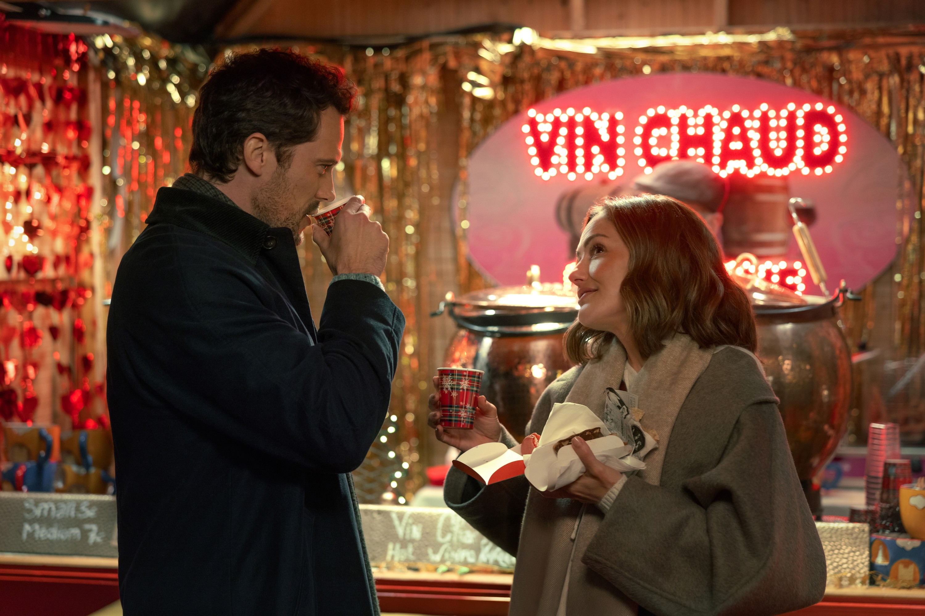 CHAMPAGNE PROBLEMS, from left: Tom Wozniczka, Minka Kelly, 2025. ph: Mika Cotellon / © Netflix /Courtesy Everett Collection