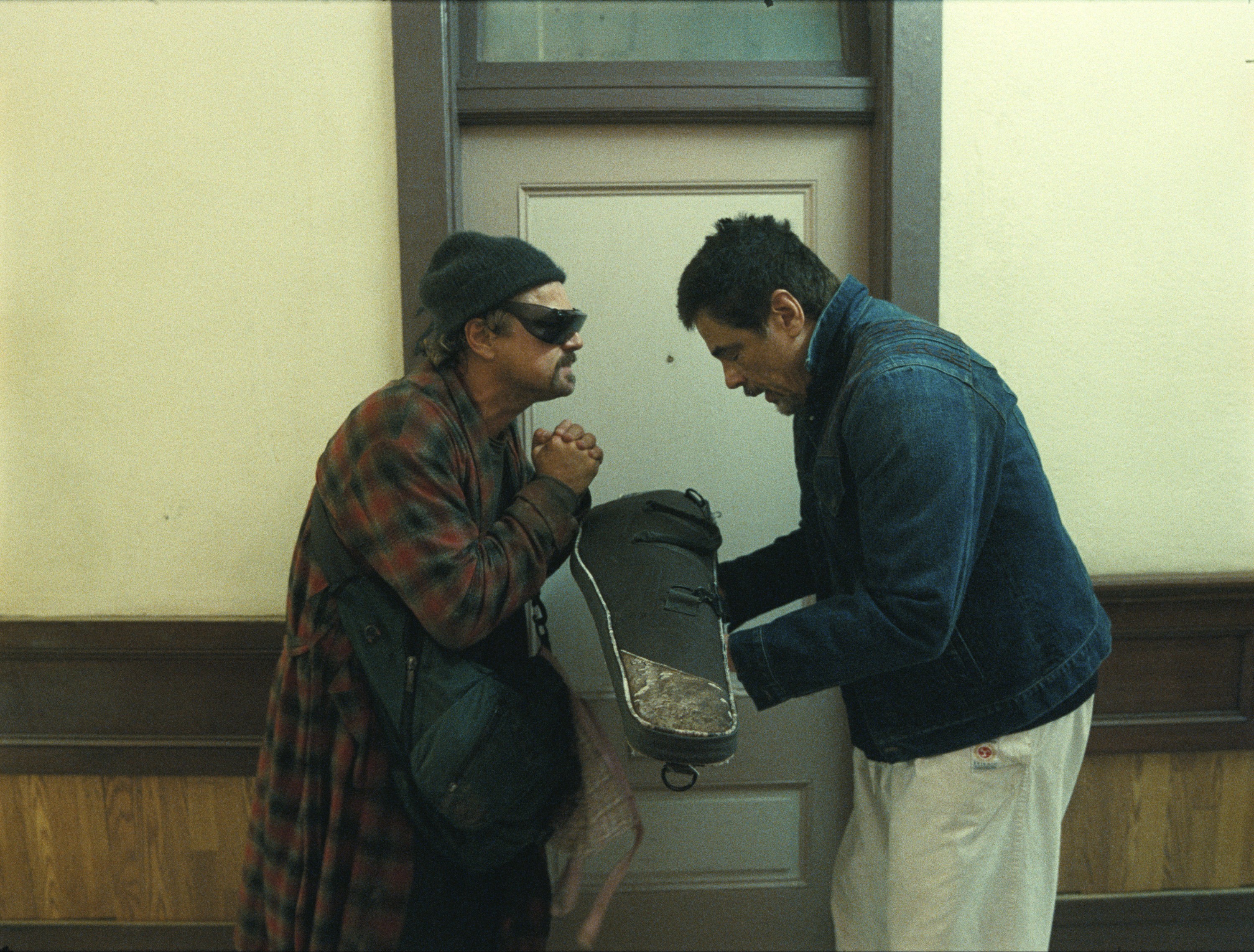 ONE BATTLE AFTER ANOTHER, from left: Leonardo DiCaprio, Benicio Del Toro, 2025. © Warner Bros. / Courtesy Everett Collection