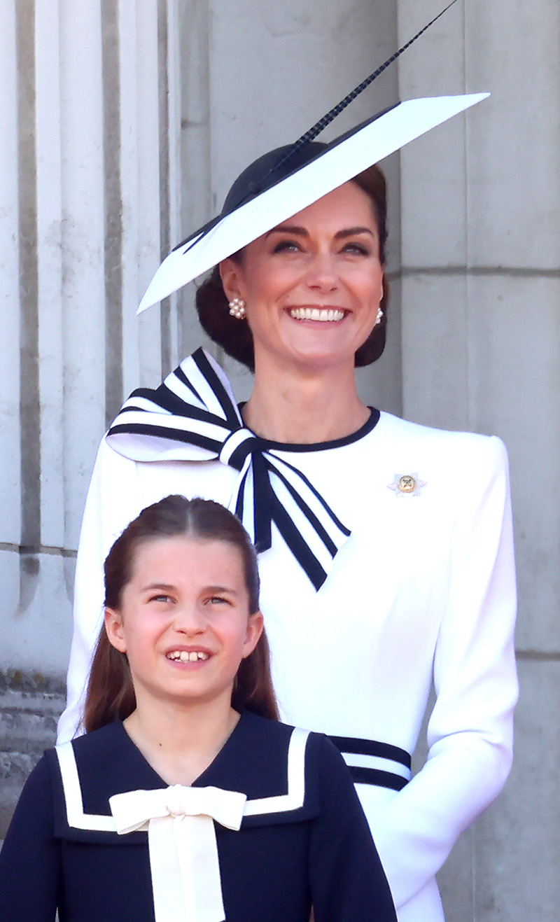 LONDON, ENGLAND - JUNE 15: Catherine, Princess of Wales, and Princess Charlotte of Wales on the balcony during Trooping the Colour at Buckingham Palace on June 15, 2024 in London, England. Trooping the Colour is a ceremonial parade celebrating the official birthday of the British Monarch. The event features over 1,400 soldiers and officers, accompanied by 200 horses. More than 400 musicians from ten different bands and Corps of Drums march and perform in perfect harmony. (Photo by Chris Jackson/Getty Images)