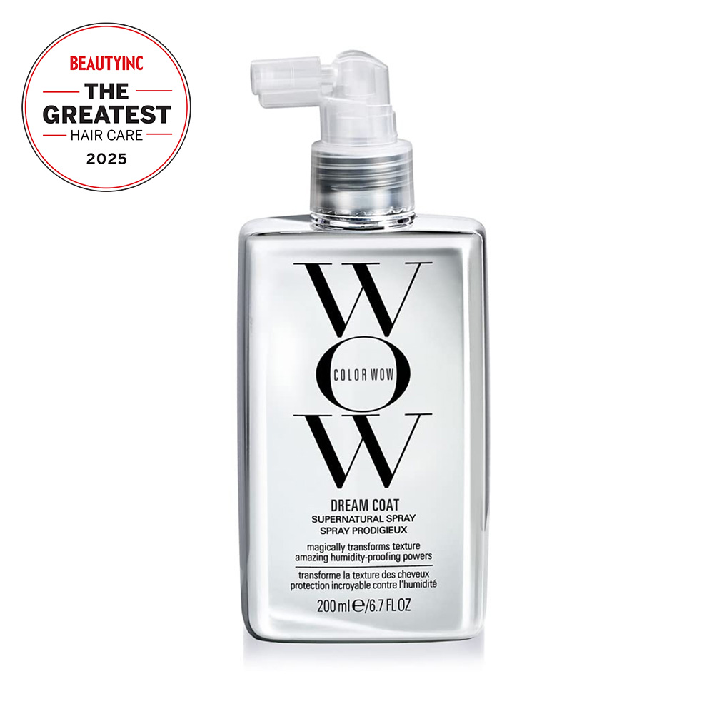 shiny grey and black bottle of spray with stylized font on its front