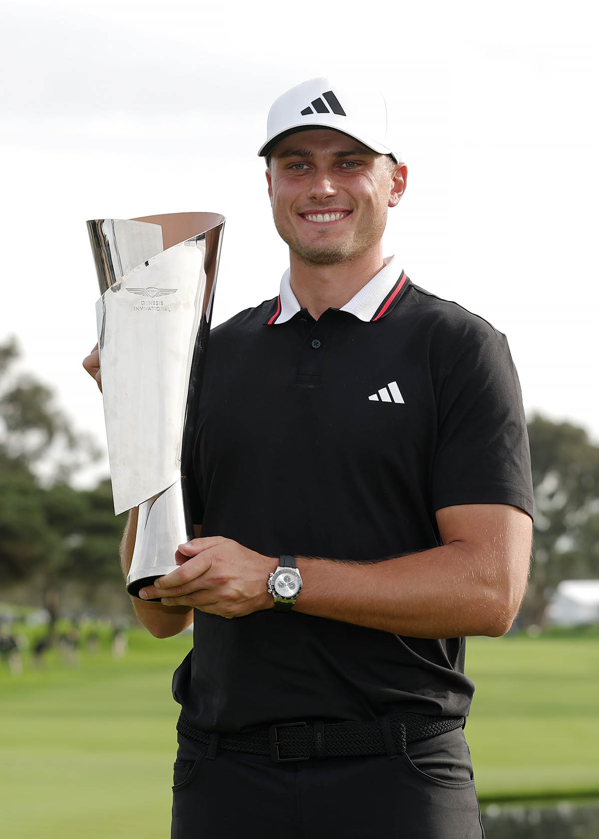 LA JOLLA, CALIFORNIA - FEBRUARY 16: Ludvig √Öberg of Sweden poses for photos with the trophy after winning The Genesis Invitational 2025 at Torrey Pines Golf Course on February 16, 2025 in La Jolla, California. (Photo by Harry How/Getty Images)
