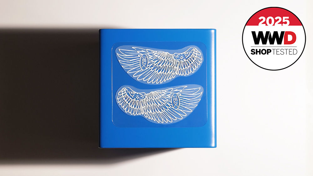 under-eye patches with a feather motif that our editors tested on a blue background