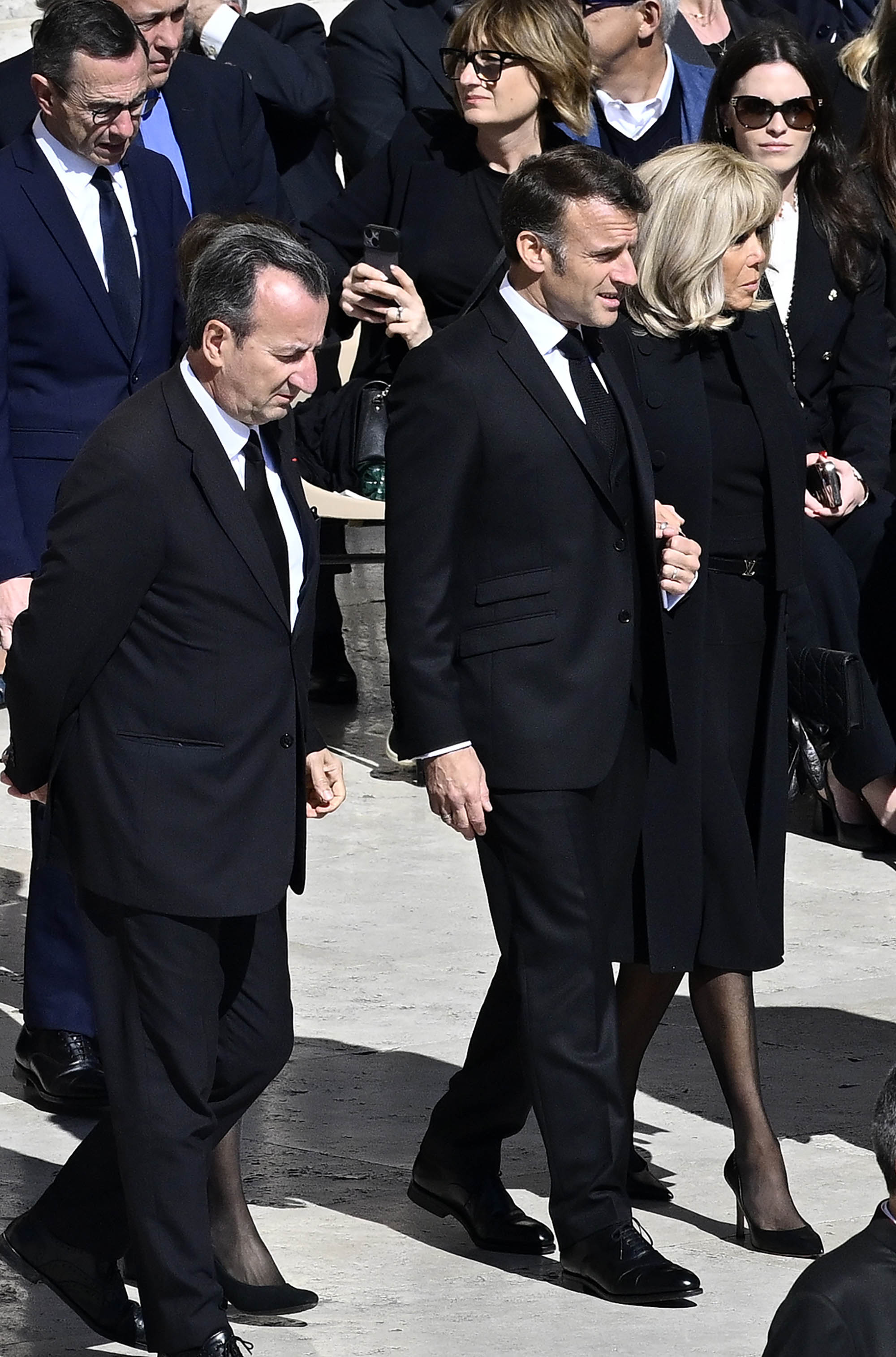 VATICAN CITY, VATICAN - APRIL¬†26: France's President Emmanuel Macron and France's First Lady Brigitte Macron arrive at the funeral of Pope Francis in St. Peter‚Äôs Square on April 26, 2025 in Vatican City, Vatican. Pope Francis died on April 21st at the age of 88. Born in Argentina as Jorge Mario Bergoglio, he was the first Latin American and the first Jesuit to become Pope when elected in 2013. Taking the name Francis after St Francis of Assisi, he promoted a more humble version of the papacy than many of his predecessors. He will be buried outside of the Vatican in a simple wooden coffin at the Basilica Santa Maria Maggiore.  (Photo by Antonio Masiello/Getty Images)