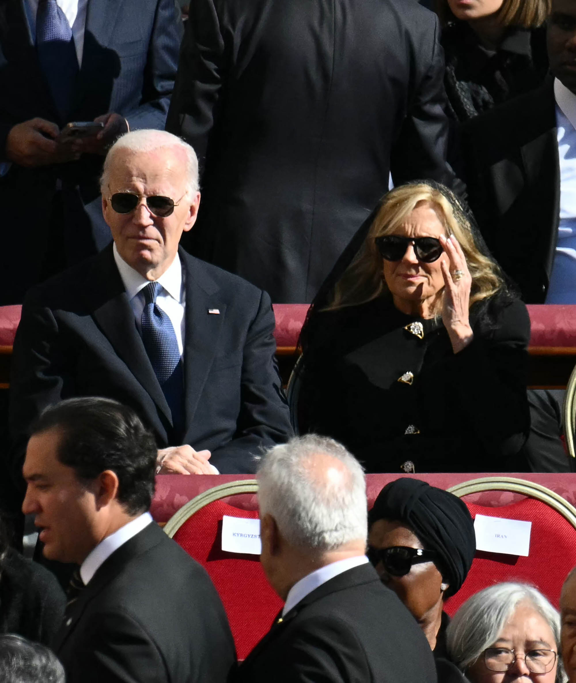 Former US President Joe Biden (L) and his wife Jill Biden (C) sit with other attendees ahead of the late Pope Francis' funeral ceremony at St Peter's Square at The Vatican on April 26, 2025. (Photo by Mandel NGAN / AFP) (Photo by MANDEL NGAN/AFP via Getty Images)