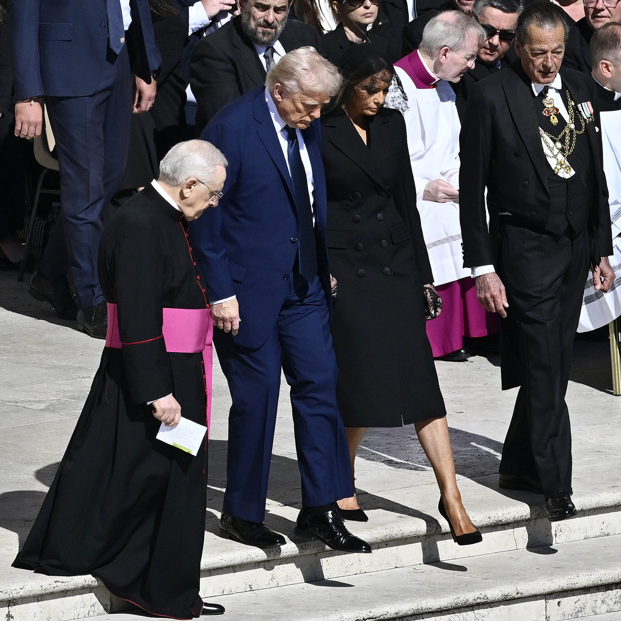 VATICAN CITY, VATICAN - APRIL¬†26: US President Donald Trump and US First Lady Melania Trump during the funeral of Pope Francis in St. Peter‚Äôs Square on April 26, 2025 in Vatican City, Vatican. Pope Francis died on April 21st at the age of 88. Born in Argentina as Jorge Mario Bergoglio, he was the first Latin American and the first Jesuit to become Pope when elected in 2013. Taking the name Francis after St Francis of Assisi, he promoted a more humble version of the papacy than many of his predecessors. He will be buried outside of the Vatican in a simple wooden coffin at the Basilica Santa Maria Maggiore.  (Photo by Antonio Masiello/Getty Images)