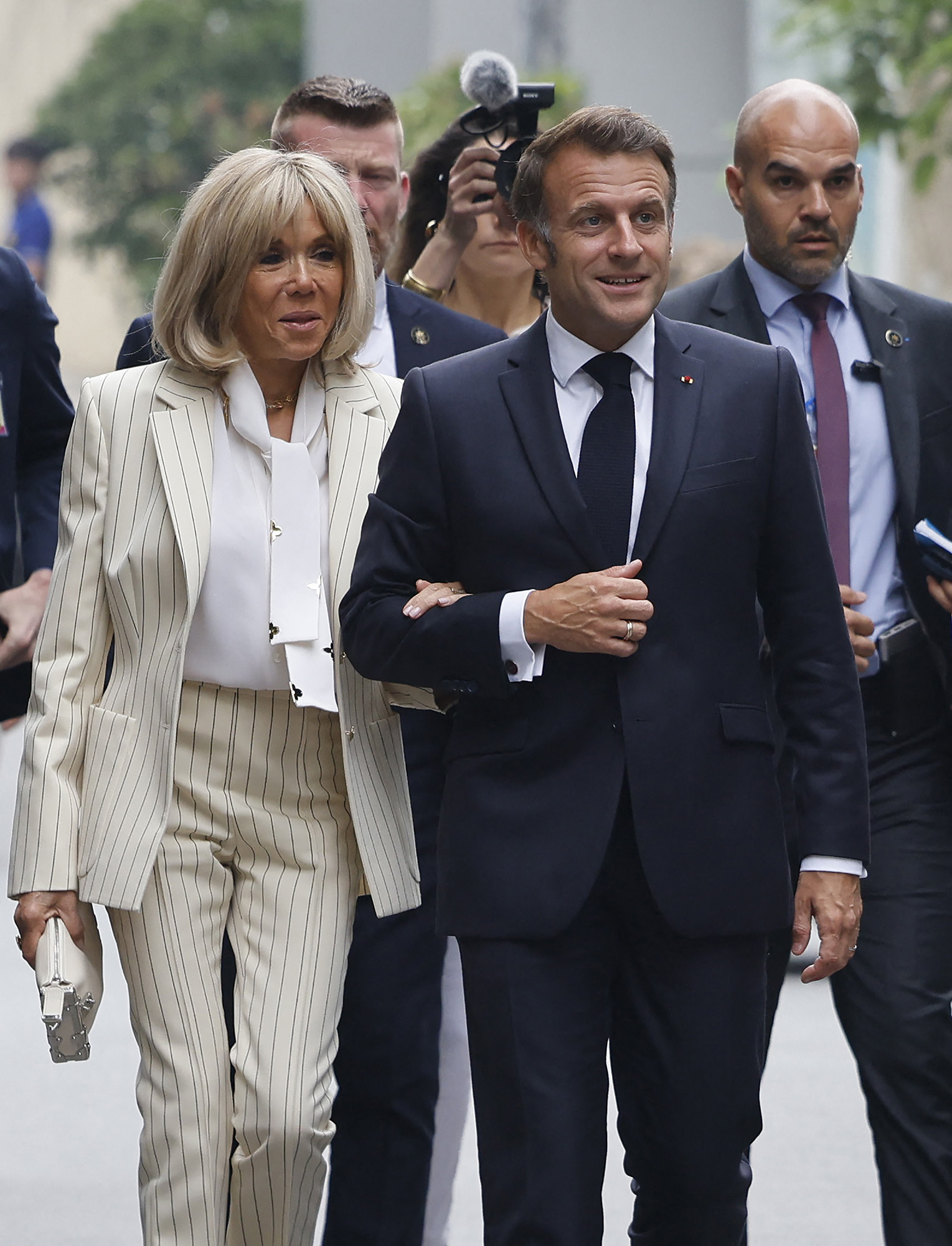 France's President Emmanuel Macron (centre R) and his wife Brigitte Macron (L) visit the University of Science and Technology in Hanoi on May 27, 2025. (Photo by Ludovic MARIN / AFP) (Photo by LUDOVIC MARIN/AFP via Getty Images)