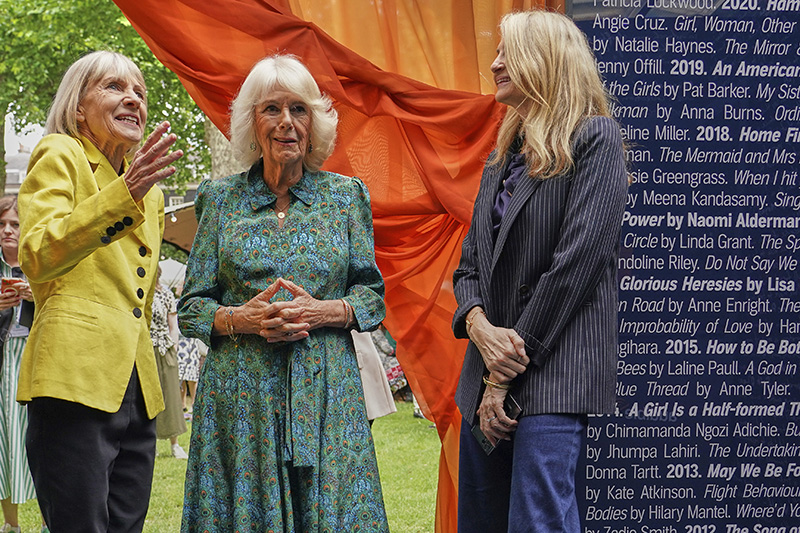 LONDON, ENGLAND - JUNE 11: Britain's Queen Camilla, centre, listens to author Kate Mosse, left, as she attends the Women's Prize for Fiction and Nonfiction event  on June 11, 2025 in London, England. (Photo by Alberto Pezzali - WPA Pool/Getty Images)