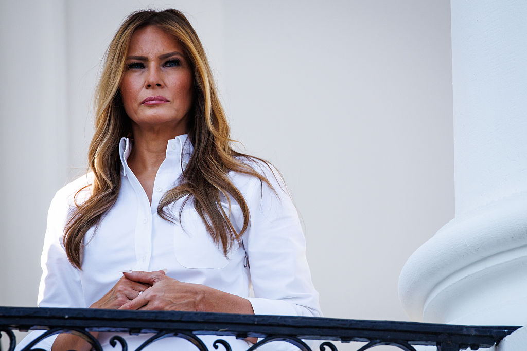 WASHINGTON, DC - JULY 04: First lady Melania Trump listens as U.S. President Donald Trump (not pictured) delivers remarks during an Independence Day military family picnic on the South Lawn of the White House on July 04, 2025 in Washington, DC. At the picnic President Trump signed the One, Big Beautiful Bill Act into law after Congress passed the bill yesterday following weeks of negotiations with Republican holdouts. The bill makes permanent President Donald Trump's 2017 tax cuts, increase spending on defense and immigration enforcement and temporarily cut taxes on tips, while cutting funding for Medicaid, food assistance and other social safety net programs. (Photo by Samuel Corum/Getty Images)