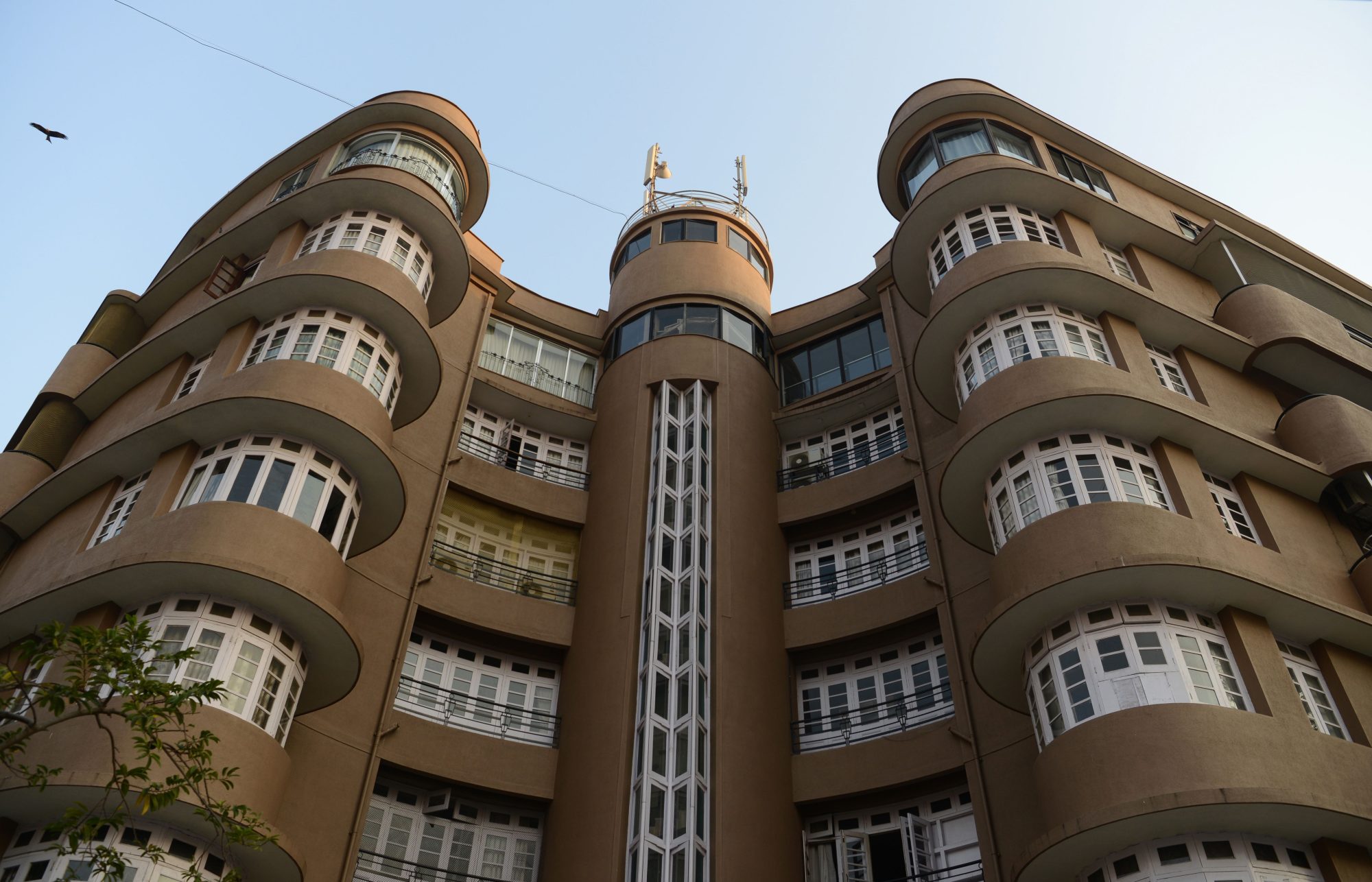 This photo taken on November 8, 2017 shows an Art Deco building in Mumbai.
The seafront is lined with brightly coloured buildings boasting curved corners, stylish balconies and exotic motifs but this isn't Miami's famous Art Deco district -- it's Mumbai. Bombay, as the Indian city was formerly called, is known more for its Victorian Gothic edifices than the sleeker architectural designs that swept Europe and America during the 1920s and '30s.
 / AFP PHOTO / PUNIT PARANJPE / To go with: 'INDIA-ARCHITECTURE-HERITAGE-ARTDECO, FEATURE' by Peter HUTCHISON        (Photo credit should read PUNIT PARANJPE/AFP via Getty Images)