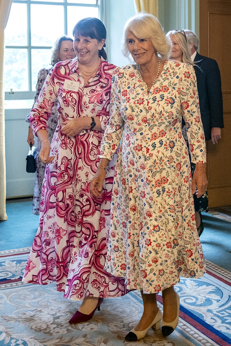 EDINBURGH, SCOTLAND - JULY 2: Queen Camilla, as patron of Queen's Nursing Institute Scotland (QNIS), with Erica Reid (left), hosts a reception for the QNIS at the Palace of Holyroodhouse on July 2, 2025 in Edinburgh, Scotland. King Charles III and Queen Camilla are visiting Scotland with members of the Royal Family for a Royal Week until Friday, July 04.  (Photo by Jane Barlow - WPA Pool/Getty Images)