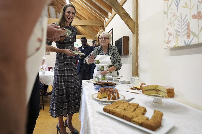 Kate Middleton wears a wide collar Alessandra Rich dress during a visit to the National Federation of Women's Institute (WI) to commemorate the three-year anniversary of the death of Queen Elizabeth II on Sept. 8, 2025 in Sunningdale, England.
