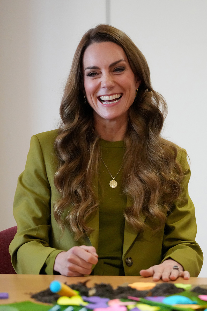 Kate Middleton wears a Victoria Beckham suit in willow green to meet families, along with the volunteers who support them, during her visit to Home-Start Oxford on Oct. 9, 2025 in Oxford, England.