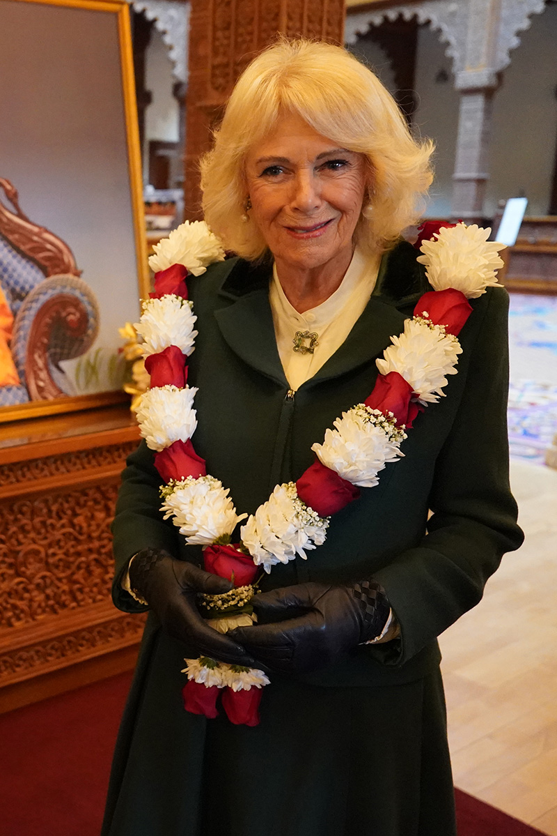 Queen Camilla wears a Roy Allen ensemble and brooch by Wartski at BAPS Shri Swaminarayan Mandir (known as the 'Neasden Temple') on Oct. 29, 2025 in London.