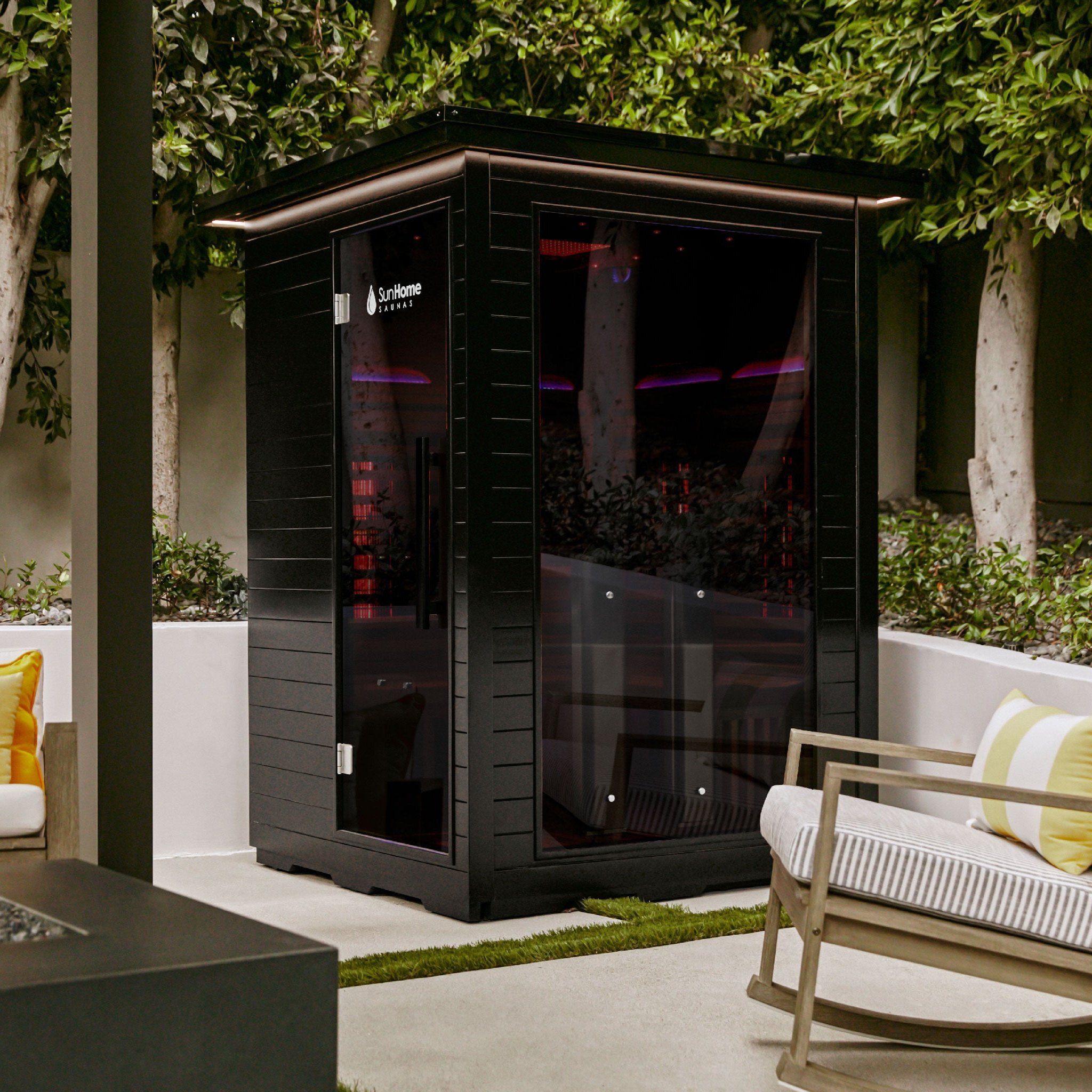 sun home saunas outdoor sauna standing in a backyard next to patio chairs and other furniture