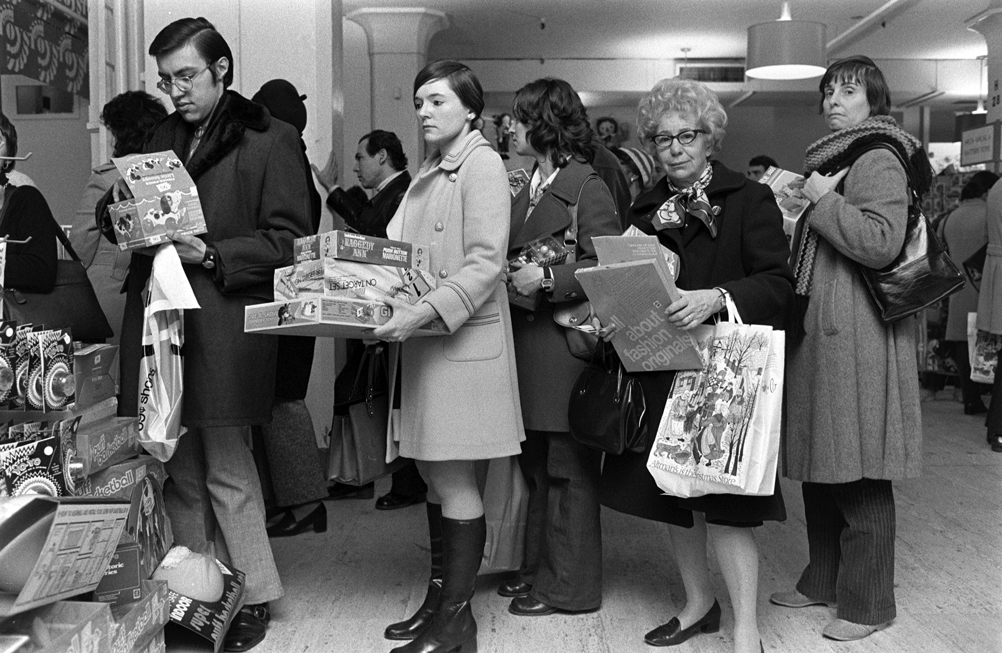 Customers wait in the holiday gift wrapping line at Macy's Herald Square, New York,