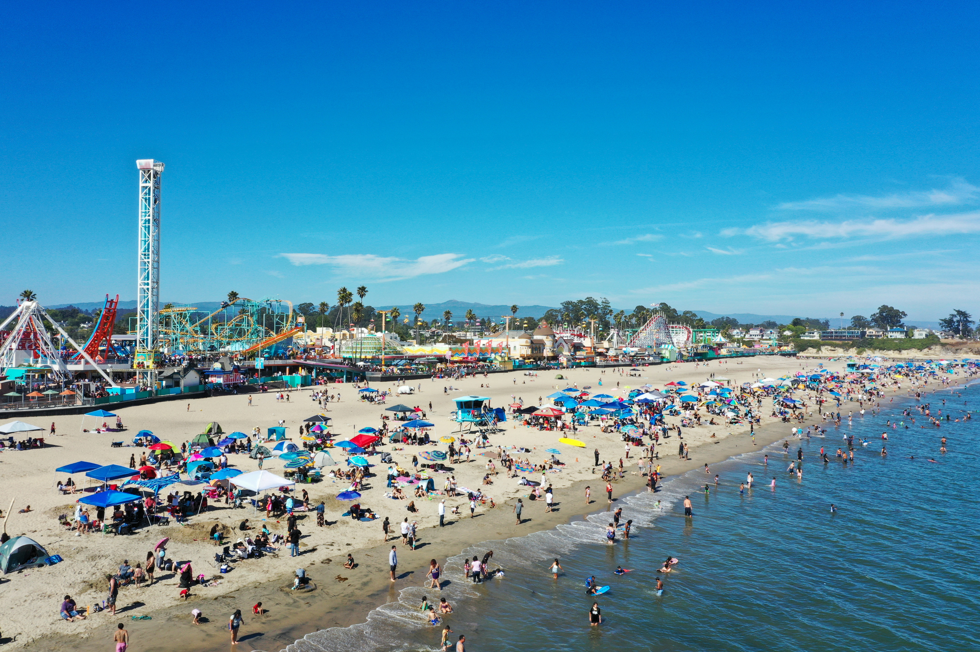 SANTA CRUZ, CALIFORNIA - JULY 30: An aerial view of Santa Cruz Beach as crowd enjoy warm weather at the beach in Santa Cruz, California, USA on July 30, 2023. (Photo by Tayfun Coskun/Anadolu Agency via Getty Images)