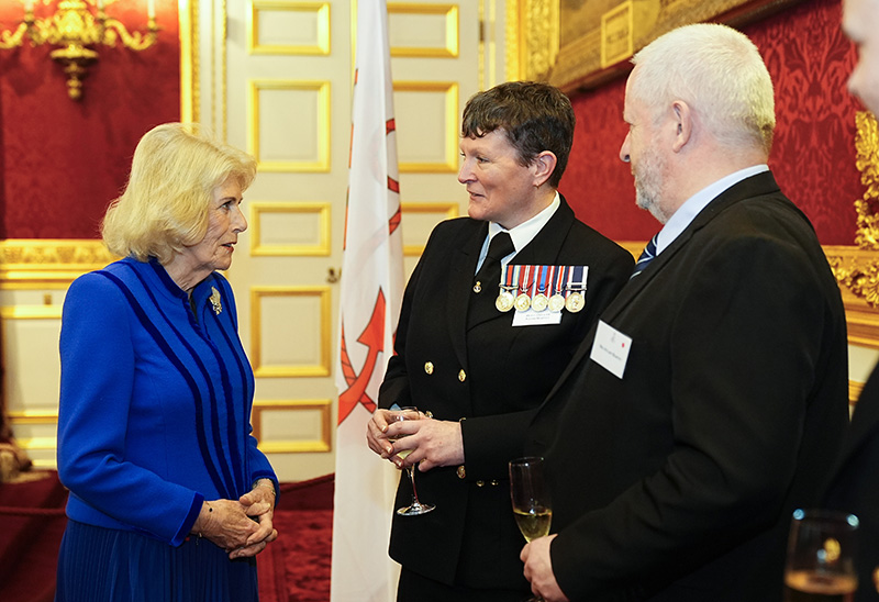LONDON, ENGLAND - DECEMBER 18: Queen Camilla talking with Petty officer Naomi Harvey during a reception at St James's Palace in London, to celebrate the return of HMS Prince of Wales from an eight-month deployment with the Carrier Strike Group (CSG25), known as Operation Highmast on December 18, 2025 in London, England. (Photo by Aaron Chown - Pool/Getty Images)