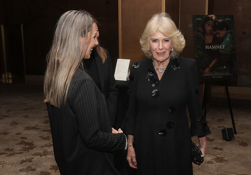 Queen Camilla wears Anna Valentine at a special screening of