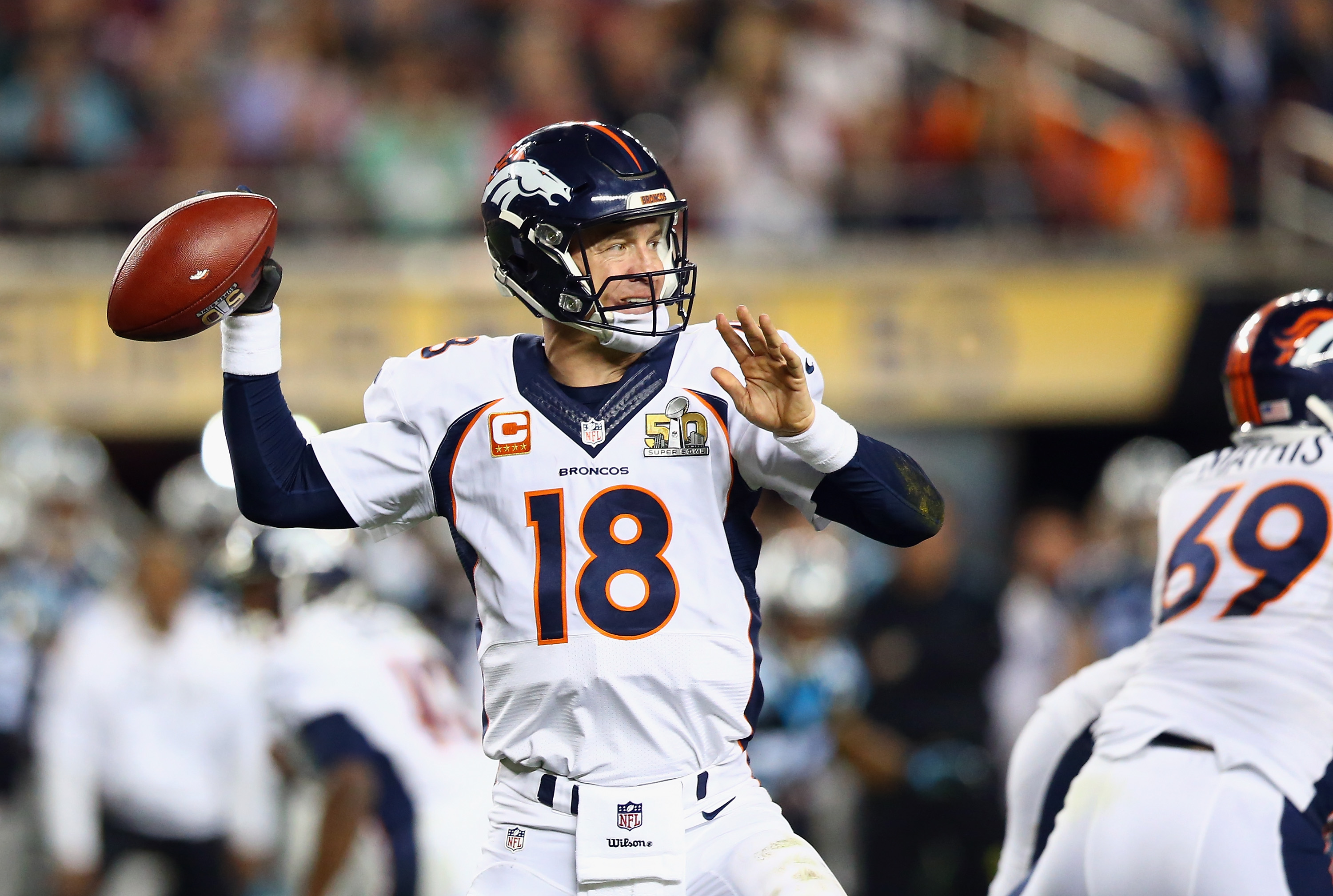SANTA CLARA, CA - FEBRUARY 07: Quarterback Peyton Manning #18 of the Denver Broncos looks to pass while playing against the Carolina Panthers during Super Bowl 50 at Levi's Stadium on February 7, 2016 in Santa Clara, California. (Photo by Ronald Martinez/Getty Images)