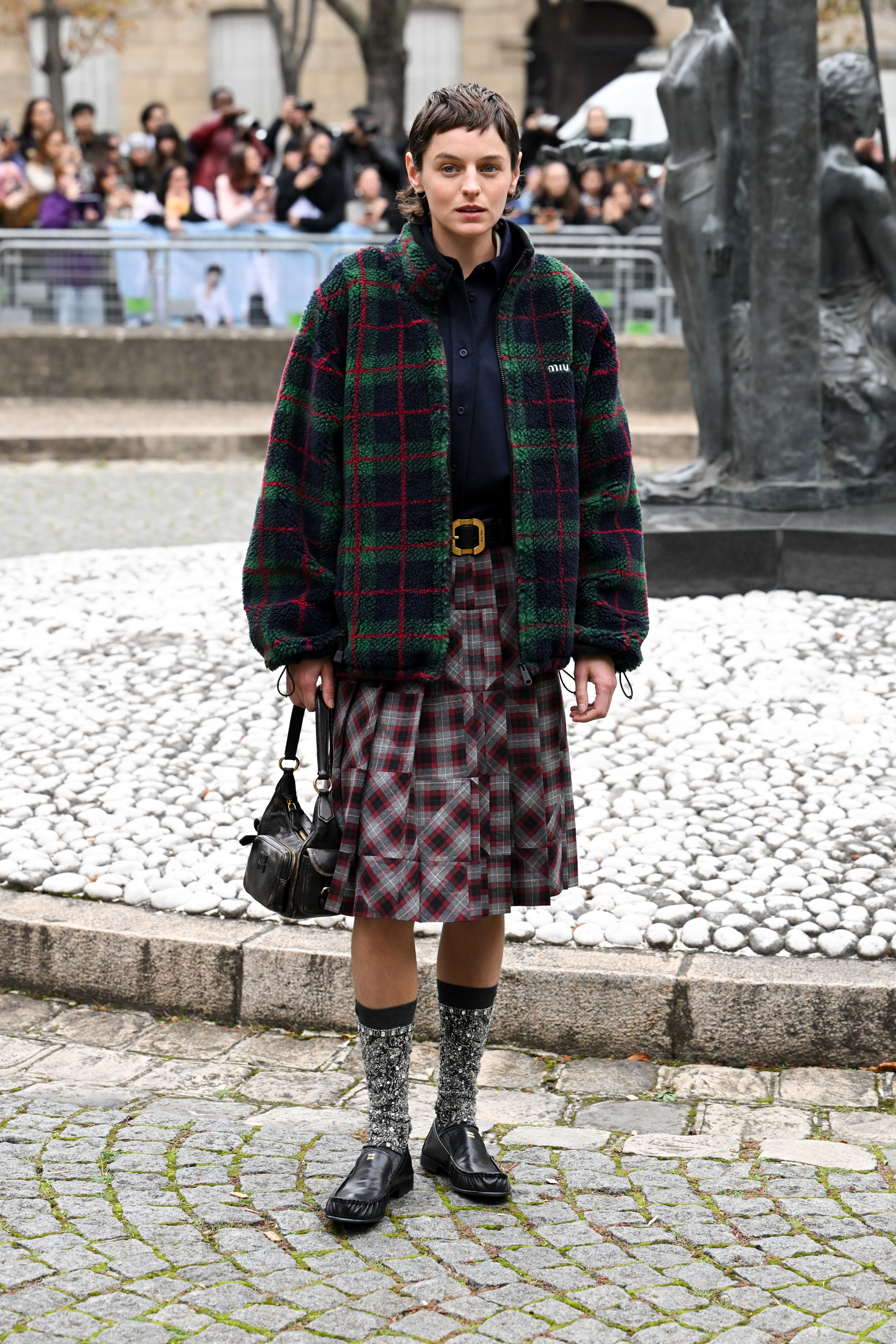 Emma Corrin at the Miu Miu fashion show as part of Spring/Summer 2026 Paris Fashion Week held at Palais d'Iena on October 06, 2025 in Paris, France.