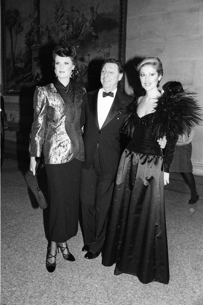 James Galanos and friends attend the Costume Institute annual gala with a retrospective of fashion designer Yves Saint Laurent at the Metropolitan Museum of Art on December 6, 1983 in New York.
