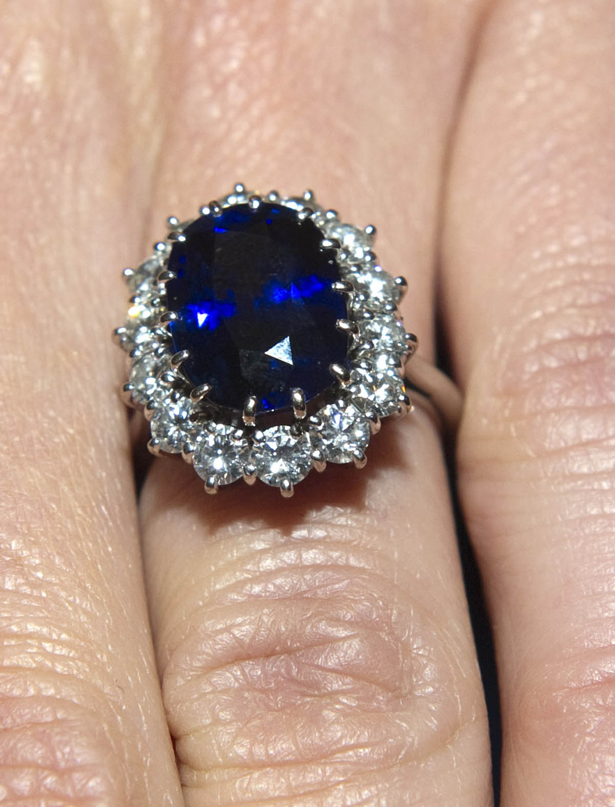 LONDON, ENGLAND - NOVEMBER 16: A close up of Kate Middleton's engagement ring as she poses for photographs in the State Apartments with her fiance Prince William of St James Palace on November 16, 2010 in London, England. After much speculation, Clarence House today announced the engagement of Prince William to Kate Middleton. The couple will get married in either the Spring or Summer of next year and continue to live in North Wales while Prince William works as an air sea rescue pilot for the RAF. The couple became engaged during a recent holiday in Kenya having been together for eight years. (Photo by Arthur Edwards - WPA Pool/Getty Images), princess diana Ceylon sapphire engagement ring, kate middleton engagement ring