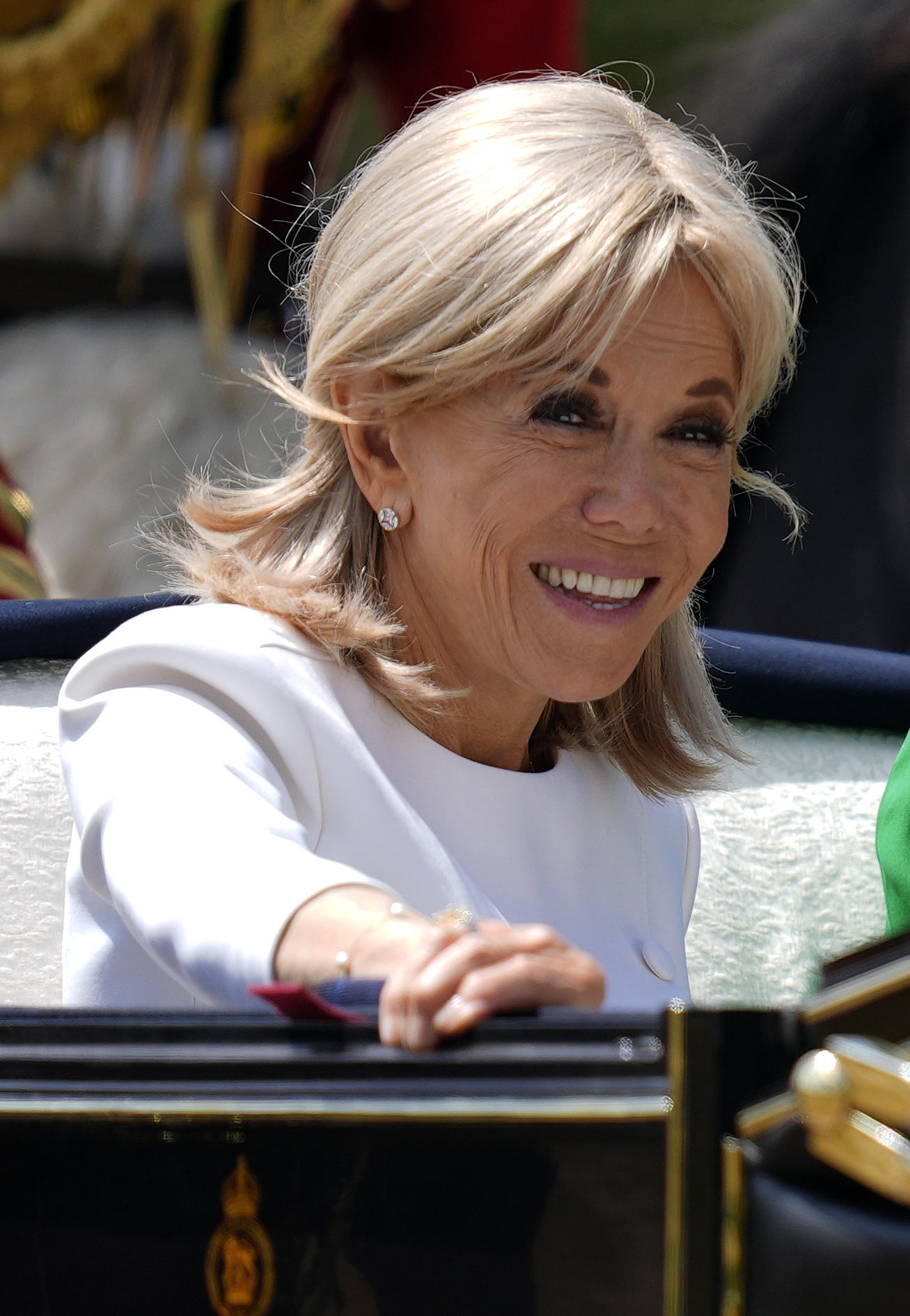 WINDSOR, ENGLAND - JULY 8: Brigitte Macron rides in the carriage procession to Windsor Castle ahead of the Ceremonial Welcome for the state visit to the UK of the President of France Emmanuel Macron and his wife Brigitte Macron at Windsor Castle on July 8, 2025 in Windsor, England. President Emmanuel Macron and Mrs Brigitte Macron visit the UK in the first visit State Visit made by France in 17 years. They are staying at Windsor Castle, hosted by King Charles III and Queen Camilla, and a banquet will be held there in their honour. The Macrons will visit Imperial College, and the President will address Parliament during his stay. (Photo by Andrew Matthews - WPA Pool/Getty Images)