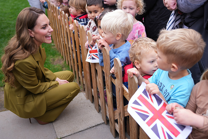 Kate Middleton wears a Victoria Beckham suit in willow green to meet families, along with the volunteers who support them, during her visit to Home-Start Oxford on Oct. 9, 2025 in Oxford, England.