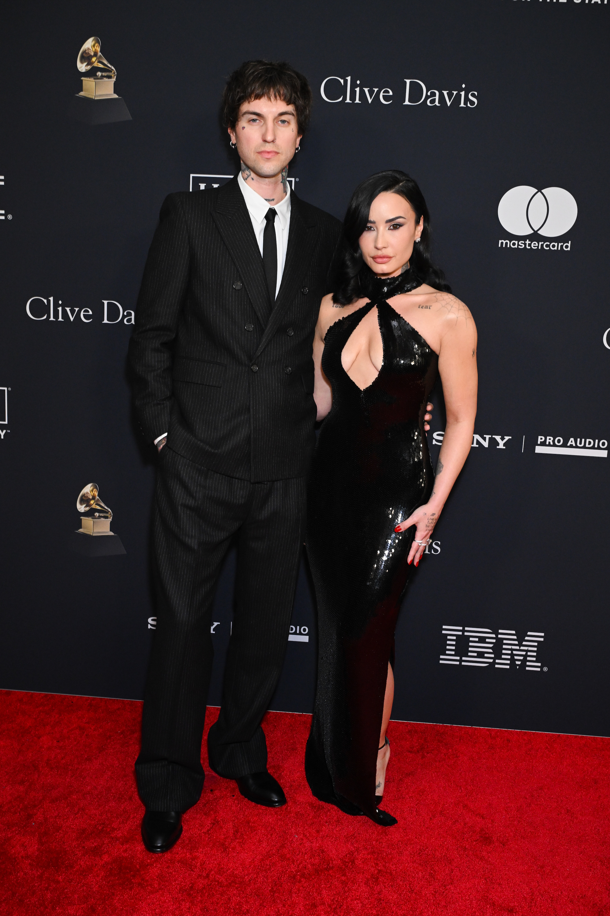 Jordan Lutes and Demi Lovato at the Pre-Grammy Gala on Jan. 31, 2026 in Los Angeles, Calif. Rodarte, celebrity style, sequin dress, sequin halter neck gown, Demi Lovato outfits